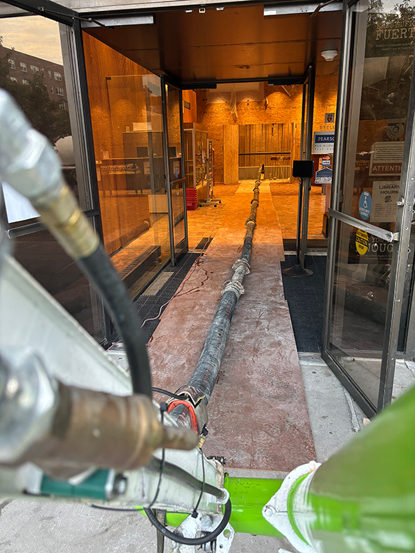 Concrete pumping into lower level. Concrete pumping into lower level.